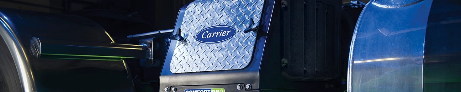 A Carrier auxiliary  power unit sitting on a truck in the sun.